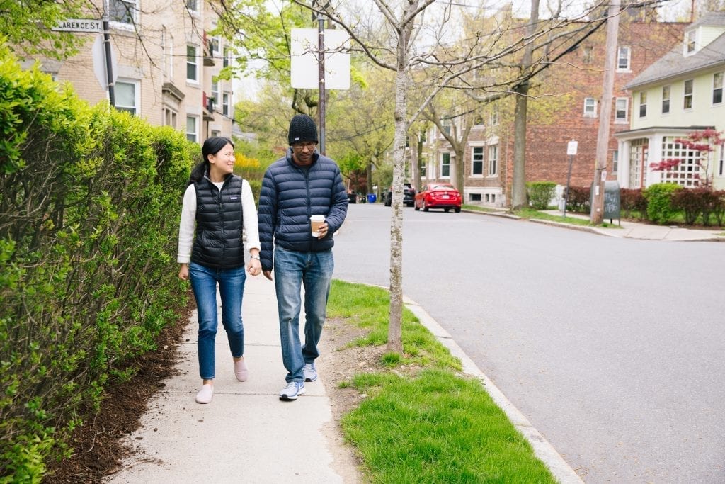 Cancer fighter and wife walking through Boston neighborhood