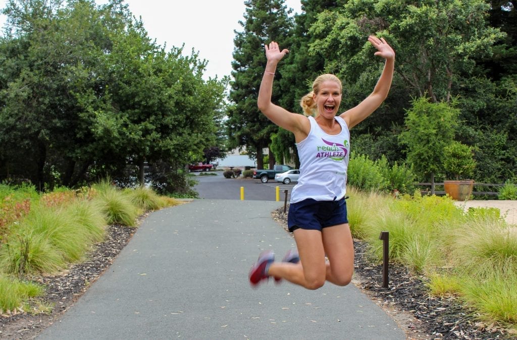 Reach Athlete jumping in air