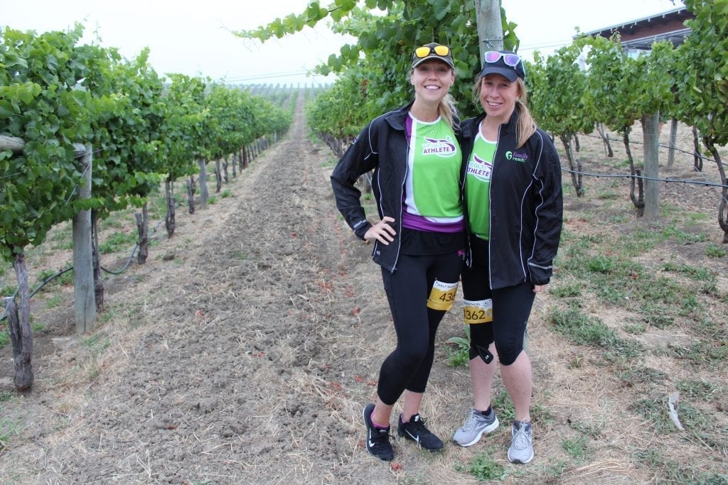 Reach Athletes standing in wine vineyard in Napa