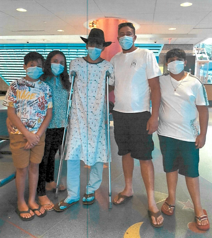 Cancer hero Erick with his family in the hospital