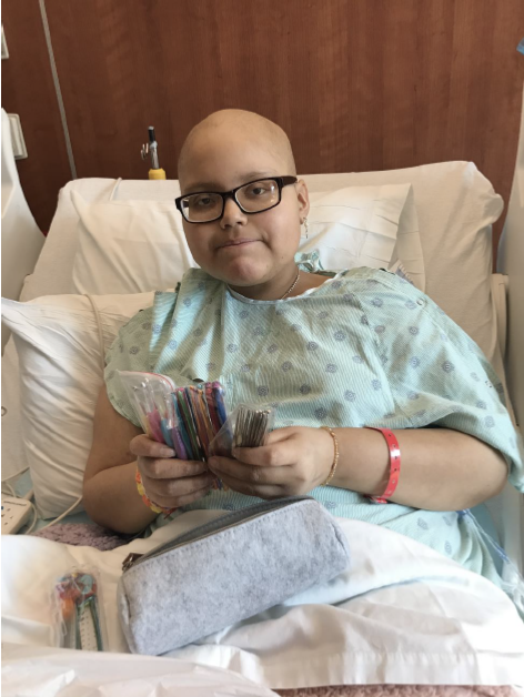 Cancer hero Andrea in the hospital bed