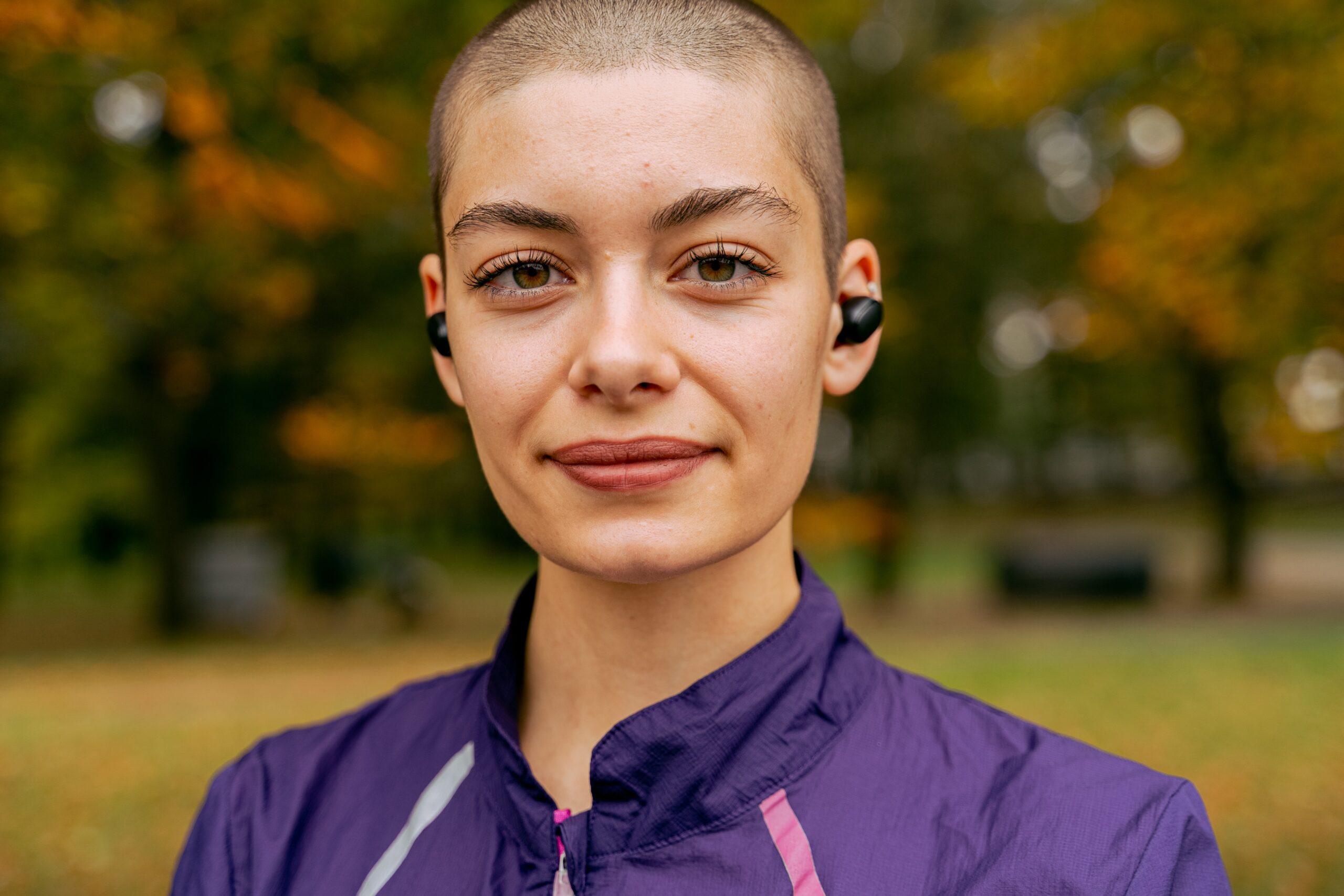 woman looking into camera with smirk of hope