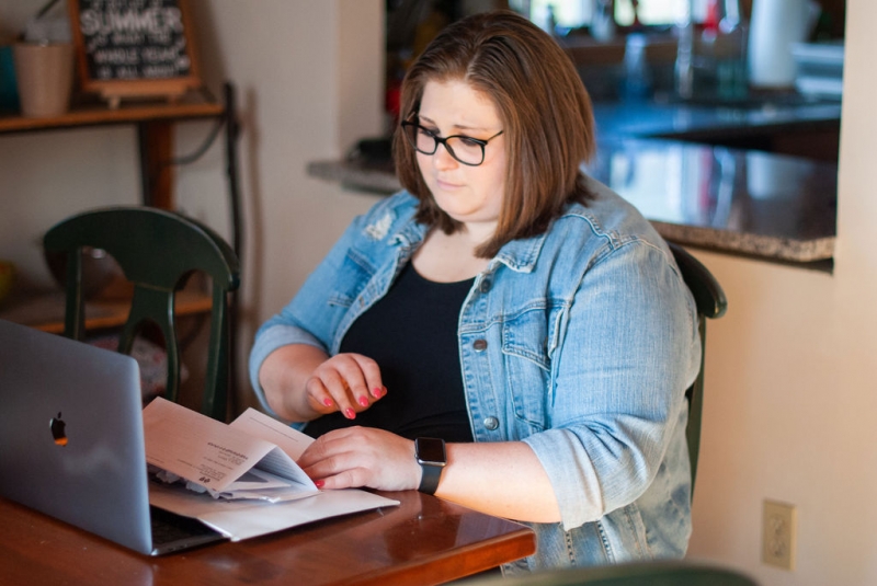 Cancer patient looking at bills